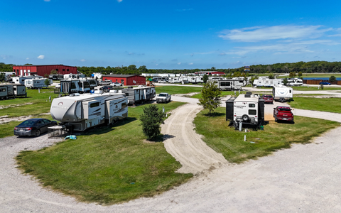 Pull-through RV sites with full hookups and wide gravel roads at Holiday Road RV Park in Texas